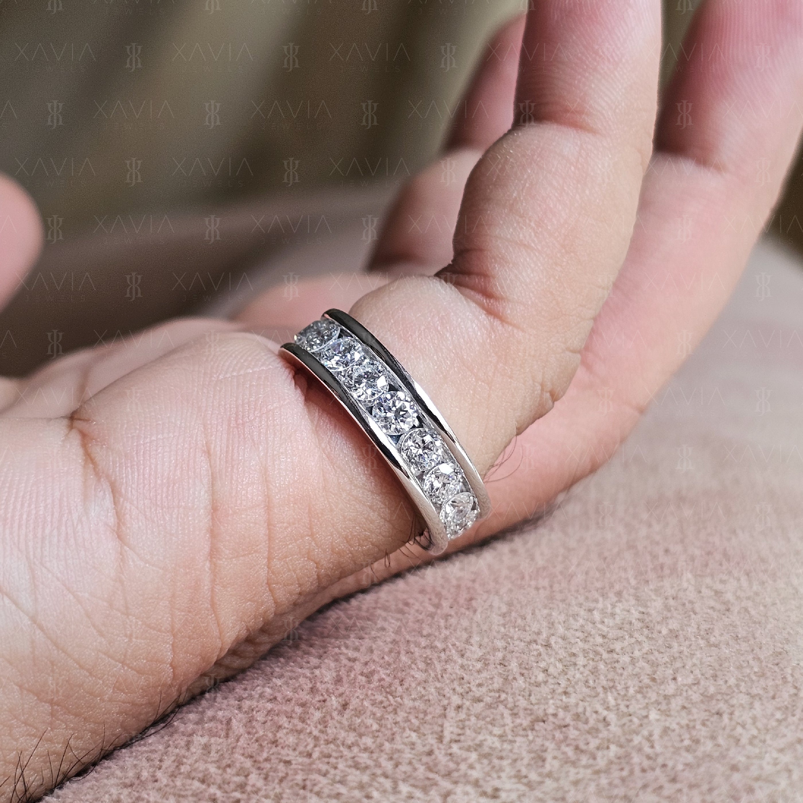Side profile of wide polished eternity wedding band featuring channel-set round lab-grown diamonds in a modern minimalist design