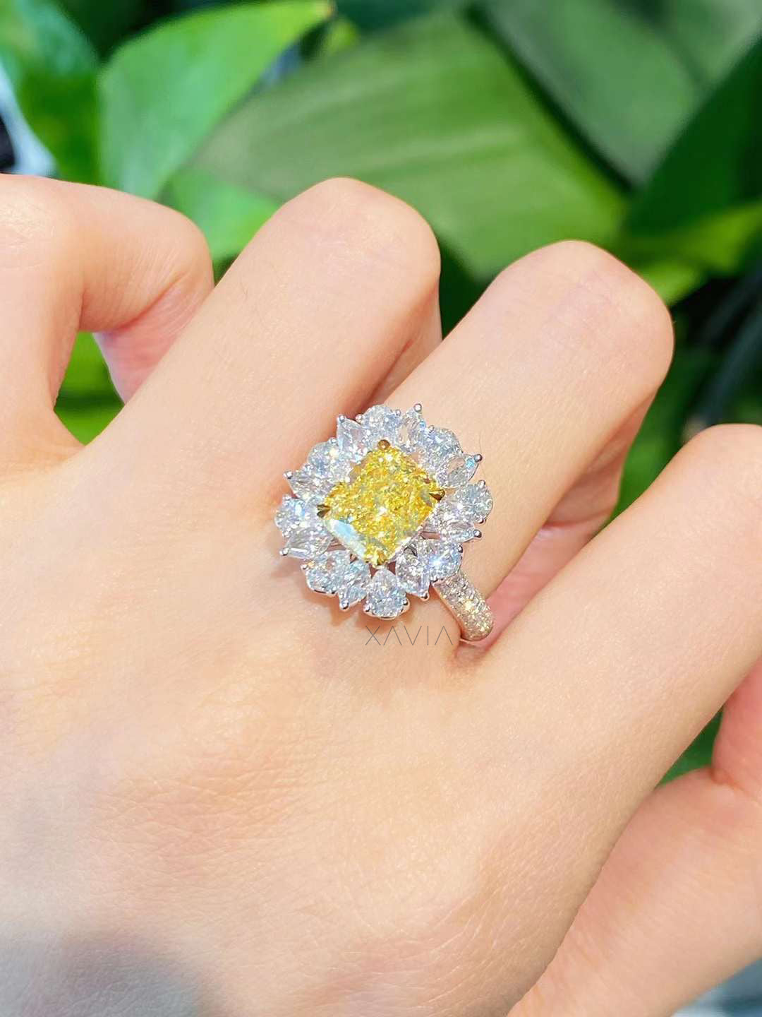 Angled view of luxury yellow lab diamond engagement ring highlighting halo depth, pavé band, and radiant brilliance