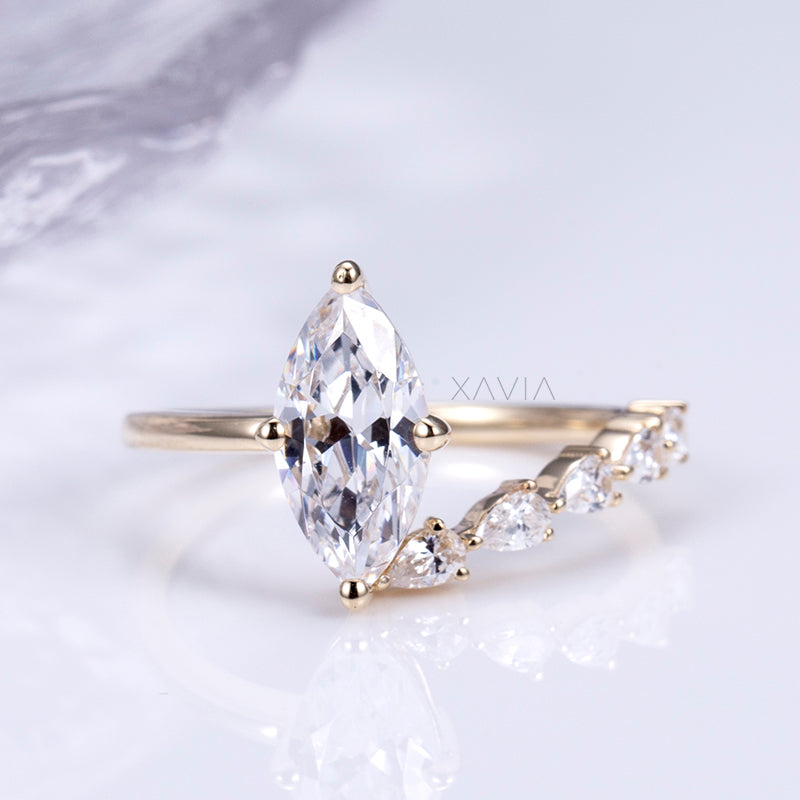 Front profile of marquise lab diamond engagement ring showing elongated center stone and asymmetric curved diamond band