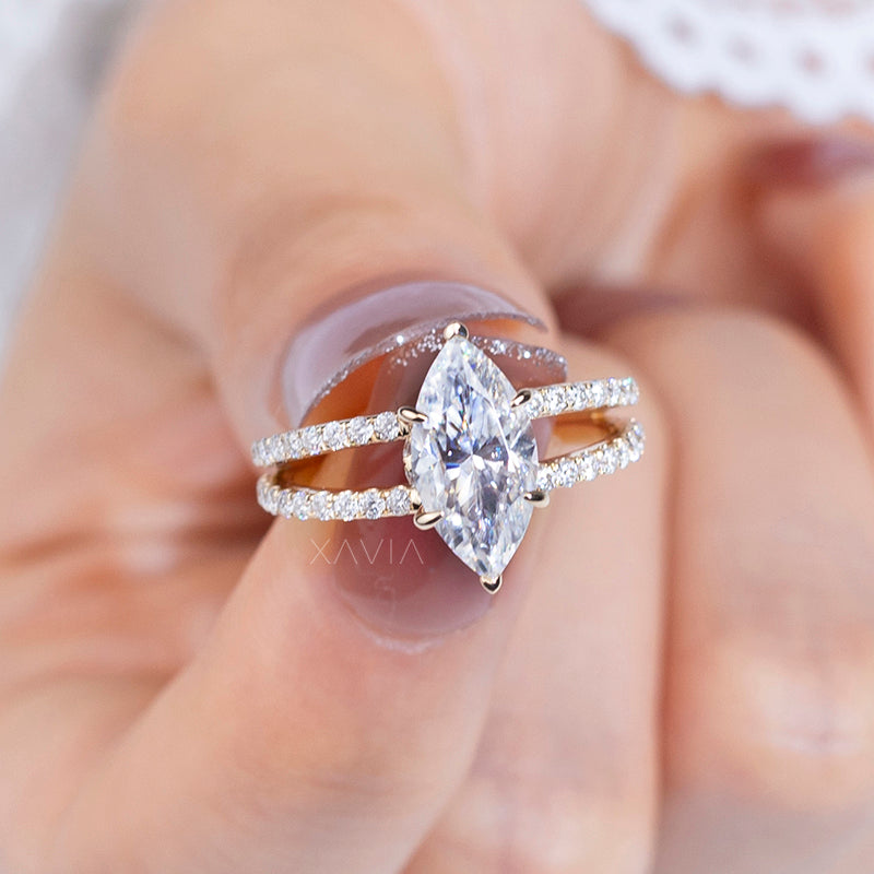 Marquise cut lab grown diamond engagement ring worn on hand, displaying elongated sparkle, pavé split shank, and refined gold finish