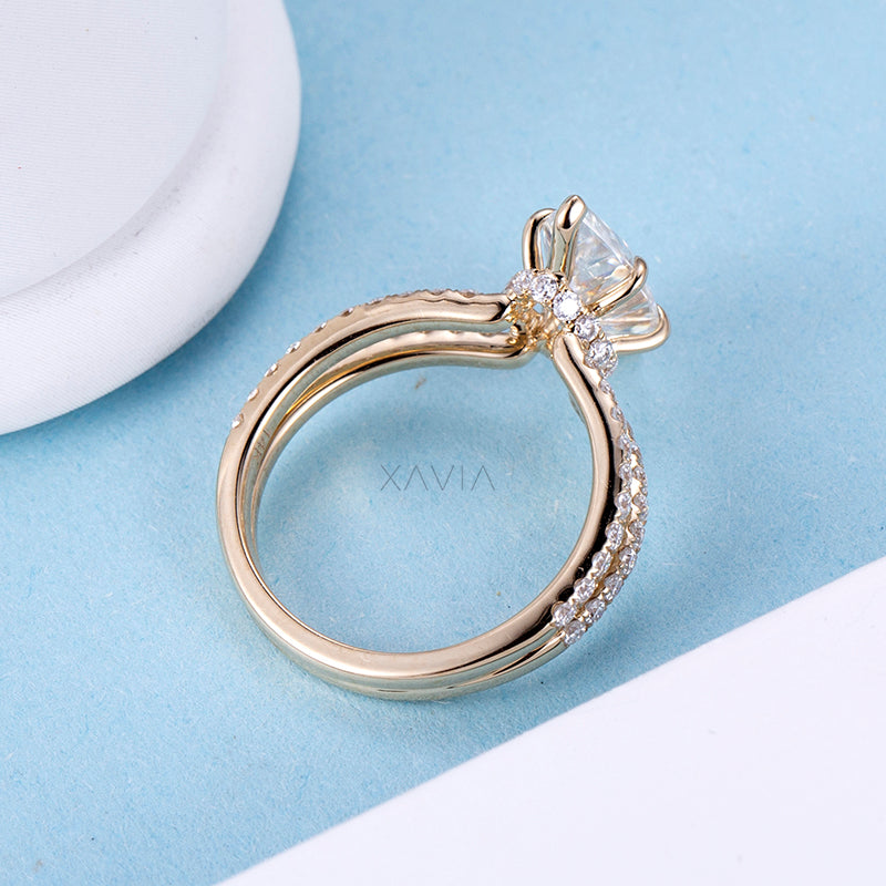 Side profile of marquise lab diamond engagement ring revealing elevated prong setting and pavé diamonds along split shank band