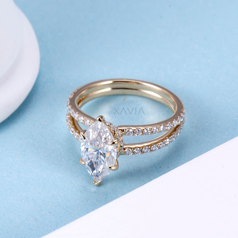 Top view of marquise cut lab grown diamond ring highlighting floating center setting and symmetrical split shank pavé diamonds