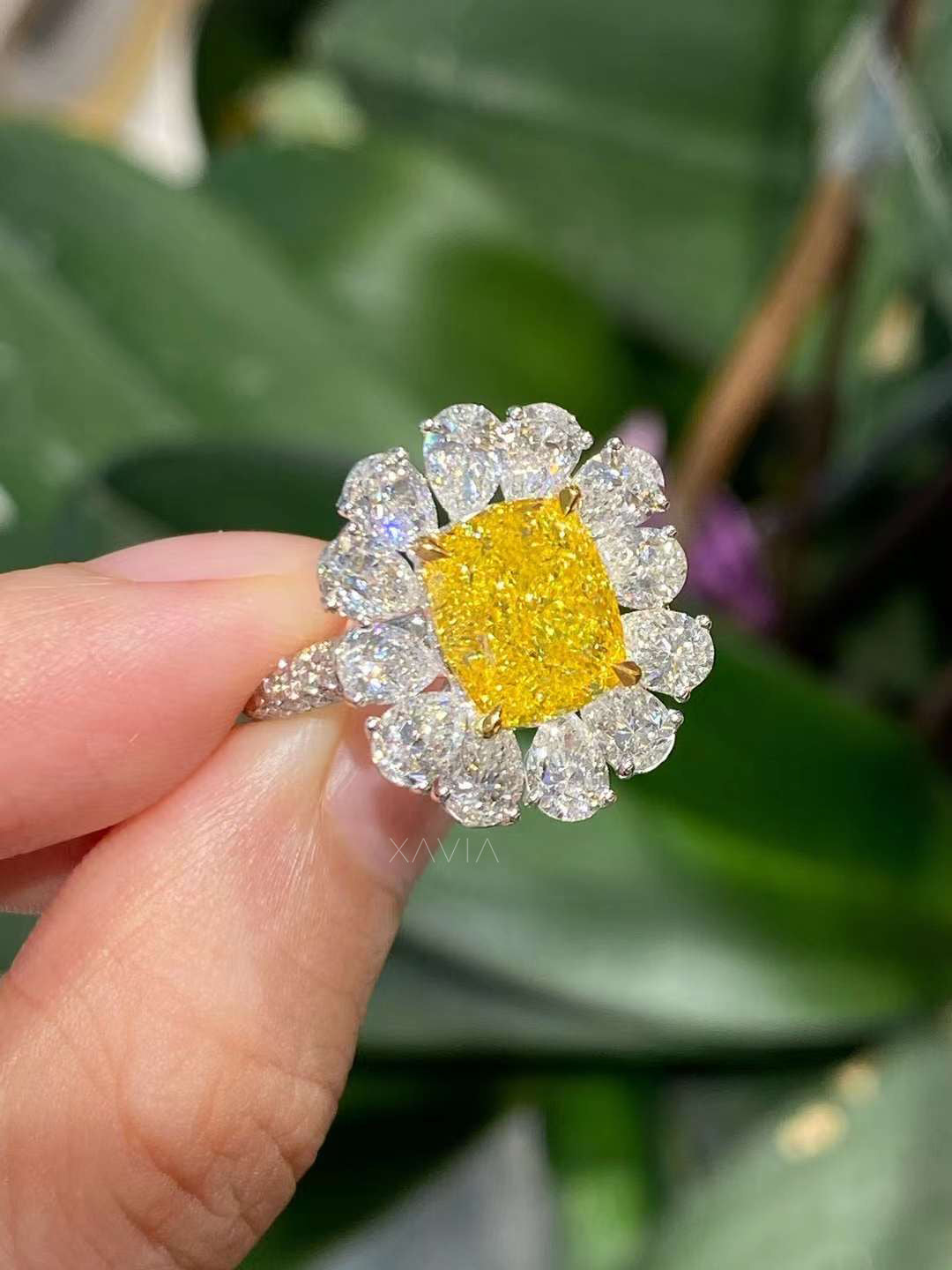 Angled view of cushion yellow diamond ring with marquise petal halo, showcasing brilliant lab grown diamonds and artisan gold setting