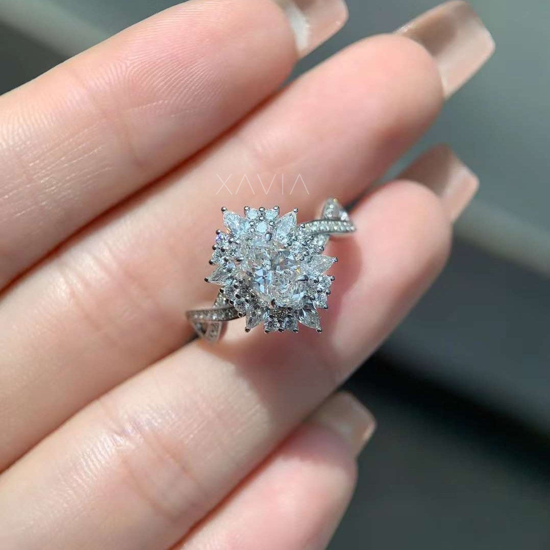 close-up of floral-inspired diamond cluster ring with marquise accents