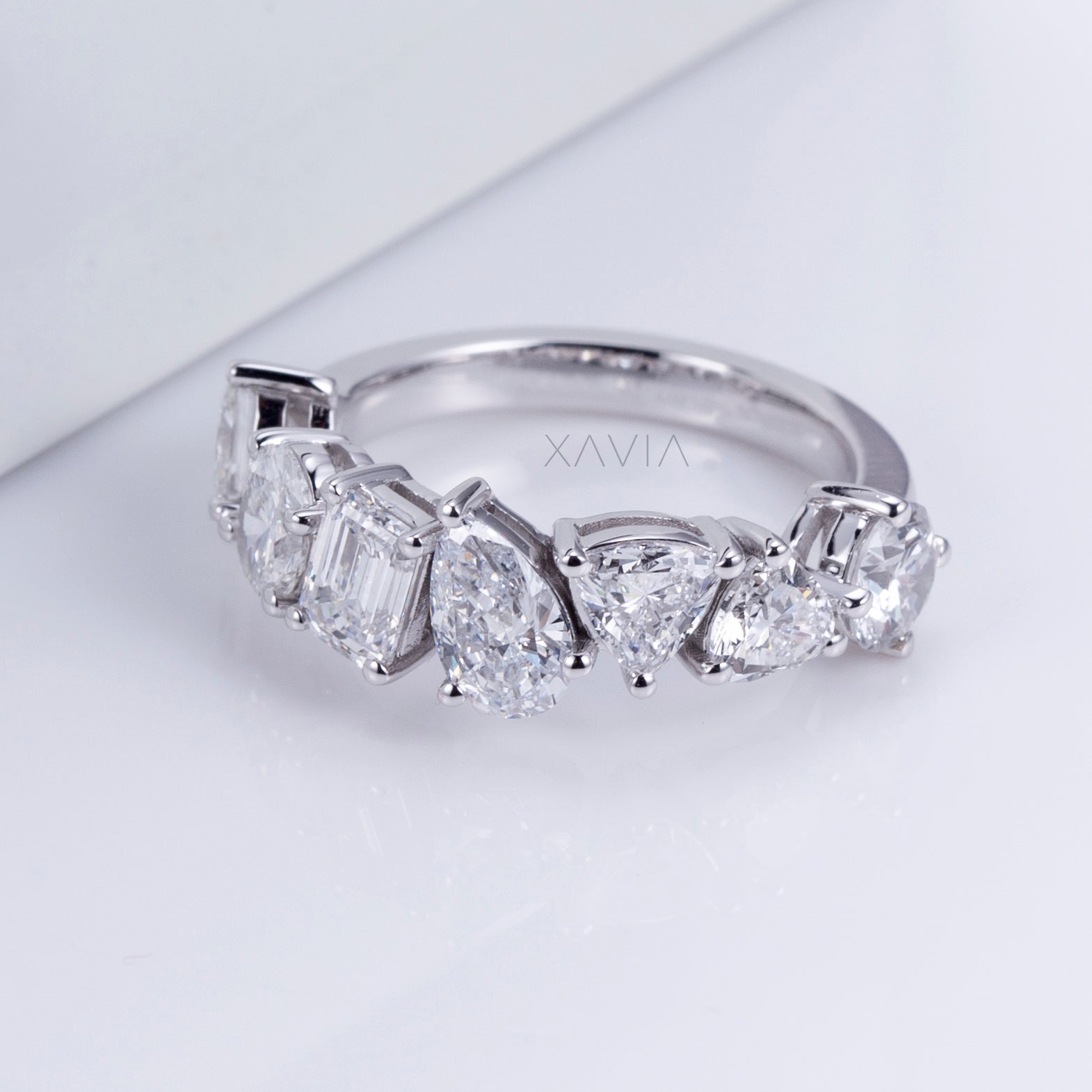 Side profile of multi-shaped ring showing gallery and prong structure