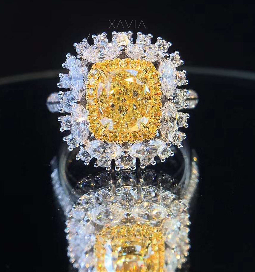 Front view of Solévia fancy yellow cushion cut lab grown diamond ring with double halo marquise and round white diamonds in a floral luxury setting