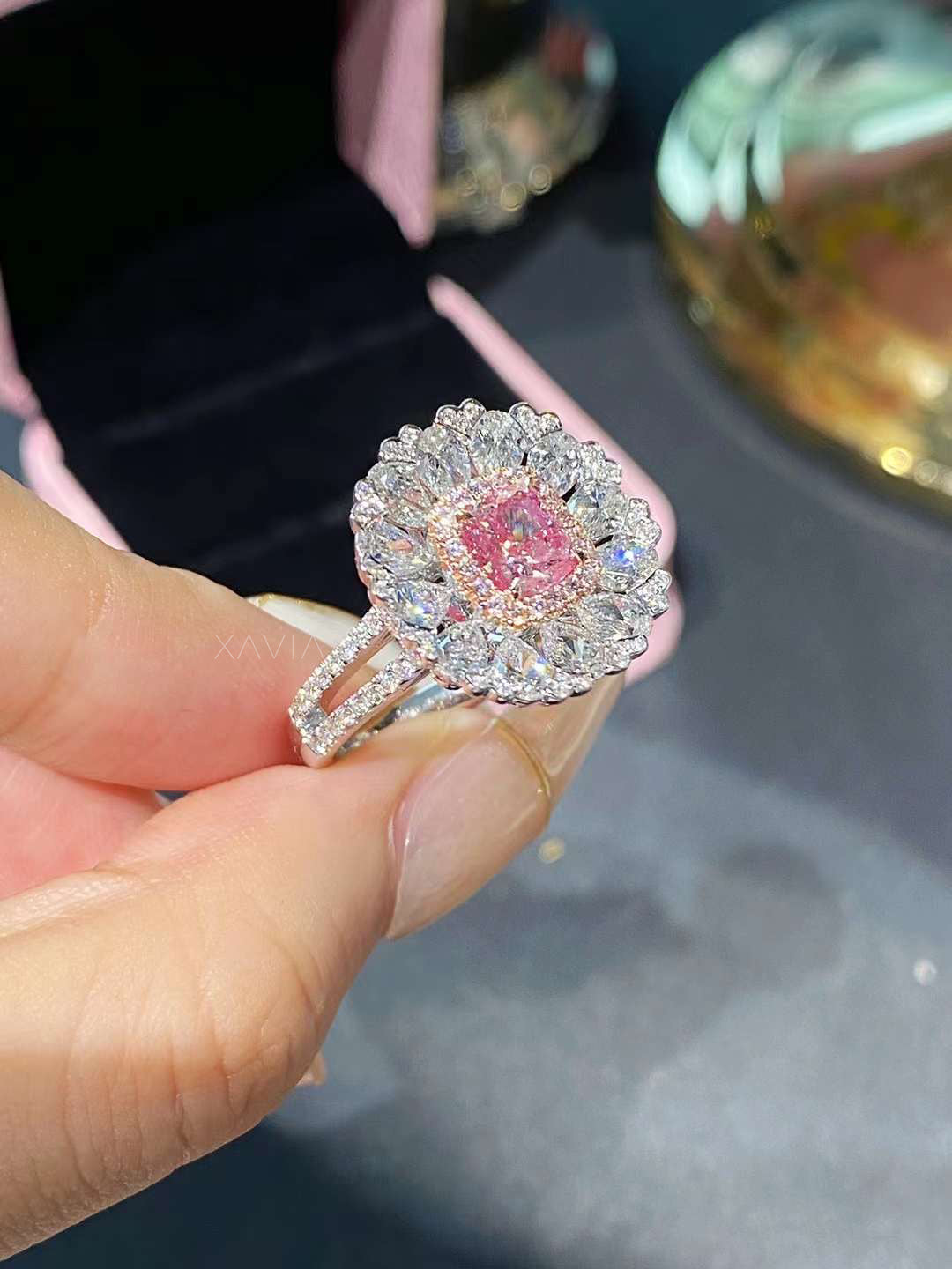 side profile of luxury couture cushion pink diamond ring with pavé band and floral halo