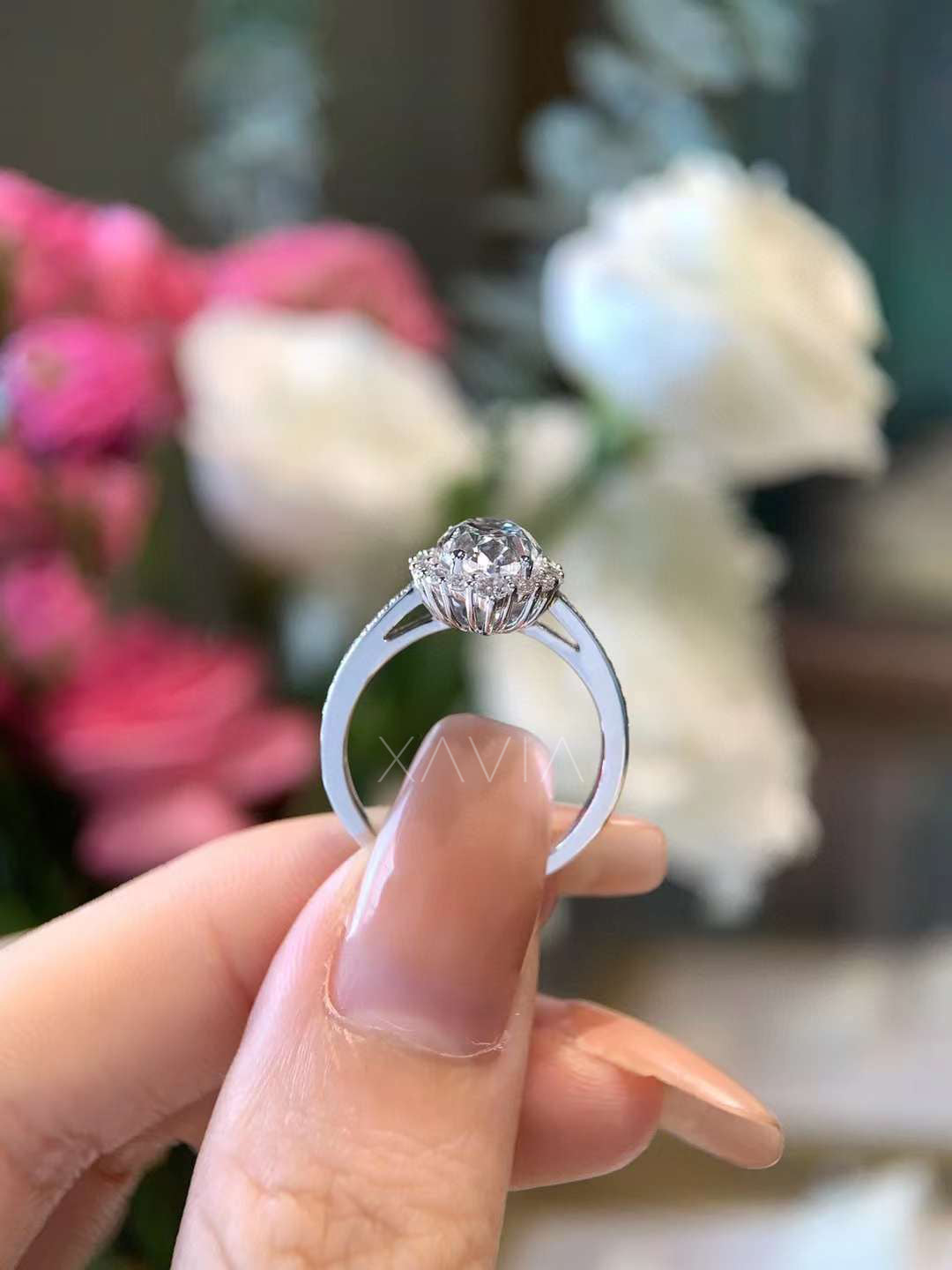 Side profile of oval lab diamond engagement ring showing elevated floral halo setting, pavé accents, and refined gallery craftsmanship