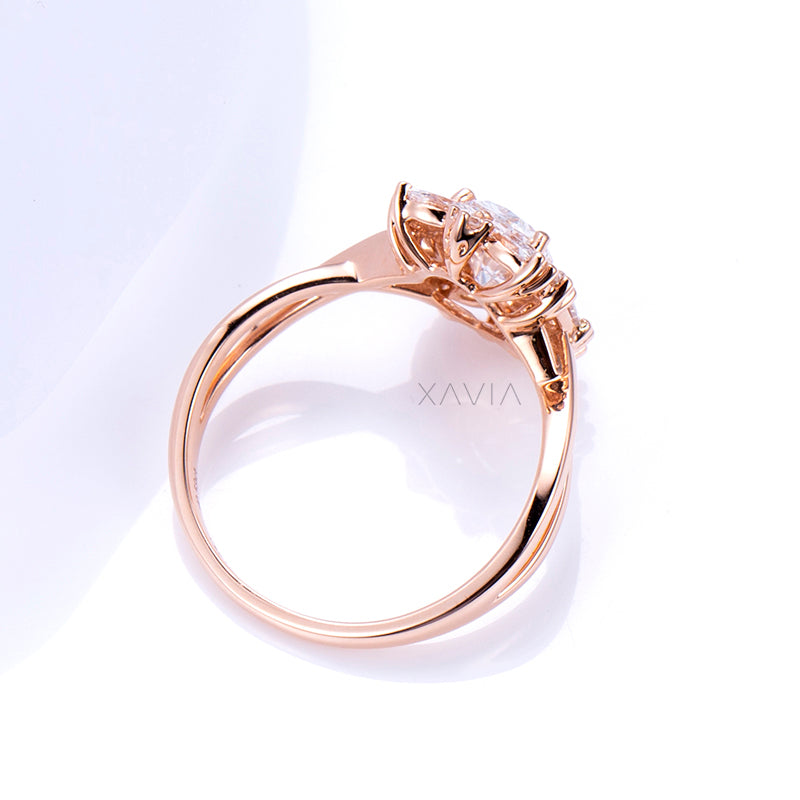 Rose gold ring with a diamond on a white background, branded 'Xavia'.