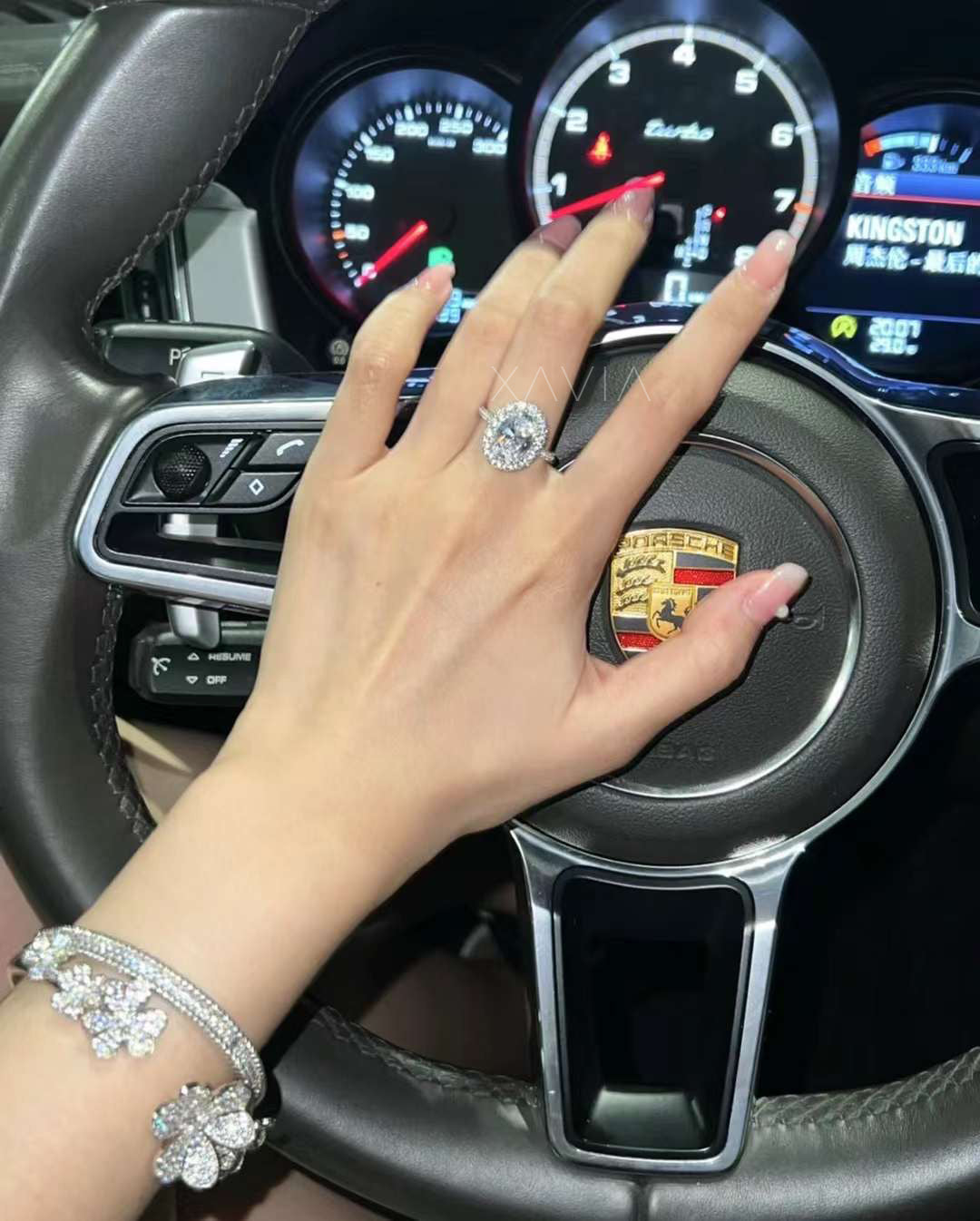 Oval cut lab diamond halo engagement ring with pavé band, worn on finger, natural light enhances diamond brilliance