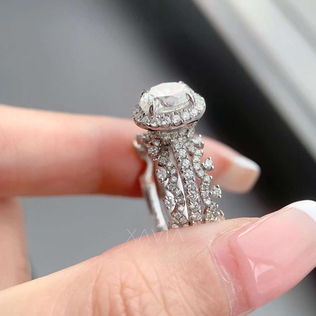 Side profile of oval lab grown diamond halo engagement ring revealing raised halo basket and ornate triple pavé vine band with clustered round diamonds