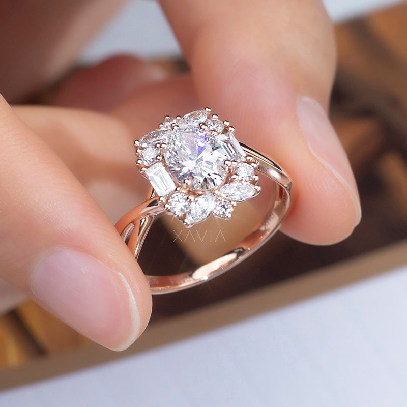Top angle view of oval cut lab grown diamond ring showcasing floral marquise halo, layered brilliance, and elegant sculpted crossover band