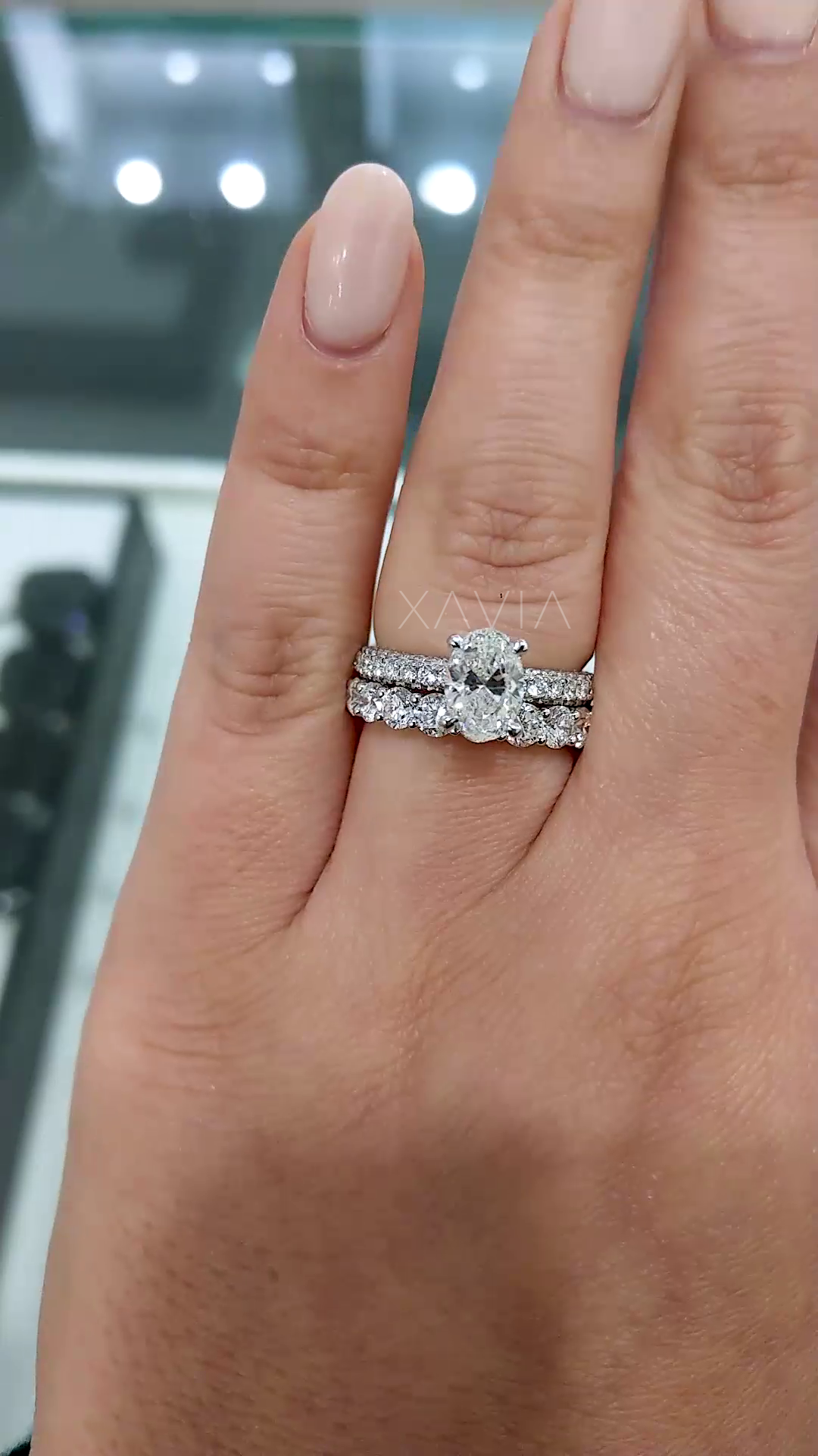 full view of oval cut lab grown diamond ring with delicate micro pave band showcasing refined craftsmanship and luxury appeal