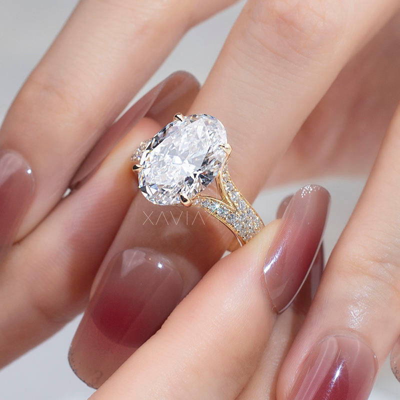 Macro angle of oval lab grown diamond engagement ring with split pavé band and cathedral structure highlighting diamond brilliance and elegant gold craftsmanship
