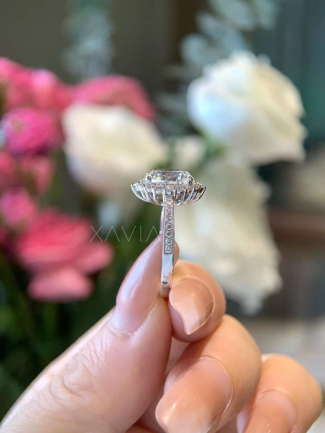 Angled profile view of oval cut lab grown diamond halo ring highlighting pavé band, elevated setting, and luxury handcrafted finish