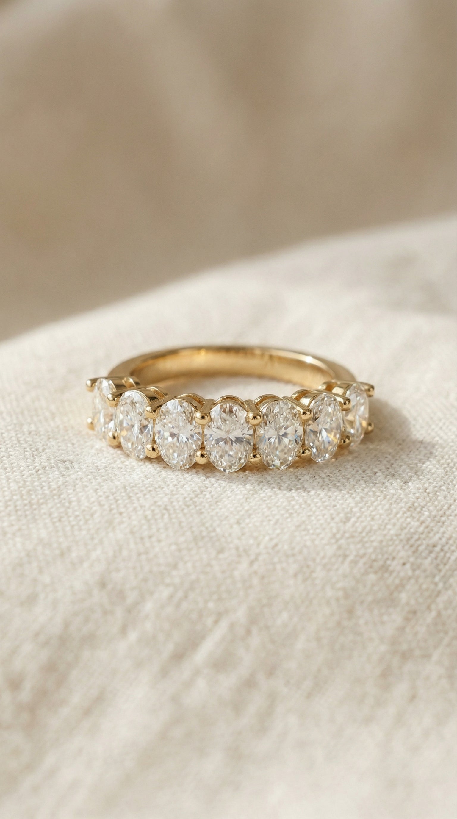 oval-diamond-half-eternity-ring-yellow-gold-lab-grown