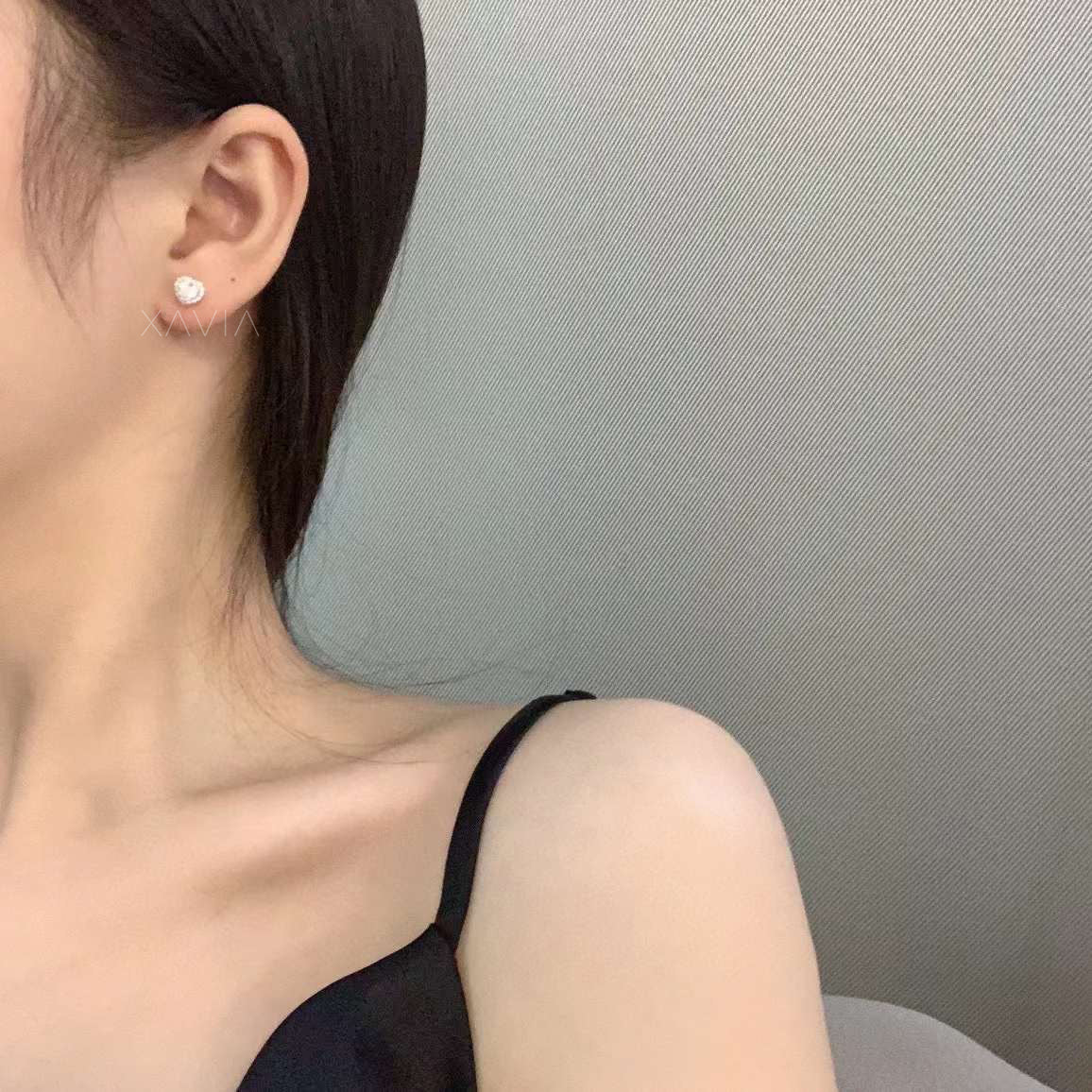 Pair of heart-shaped diamond studs in high-polish finish