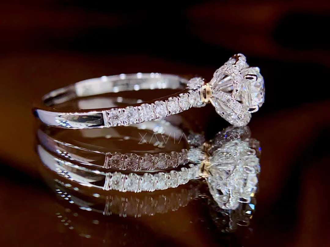 pavé band engagement ring with round cut lab diamond center stone and delicate floral halo setting