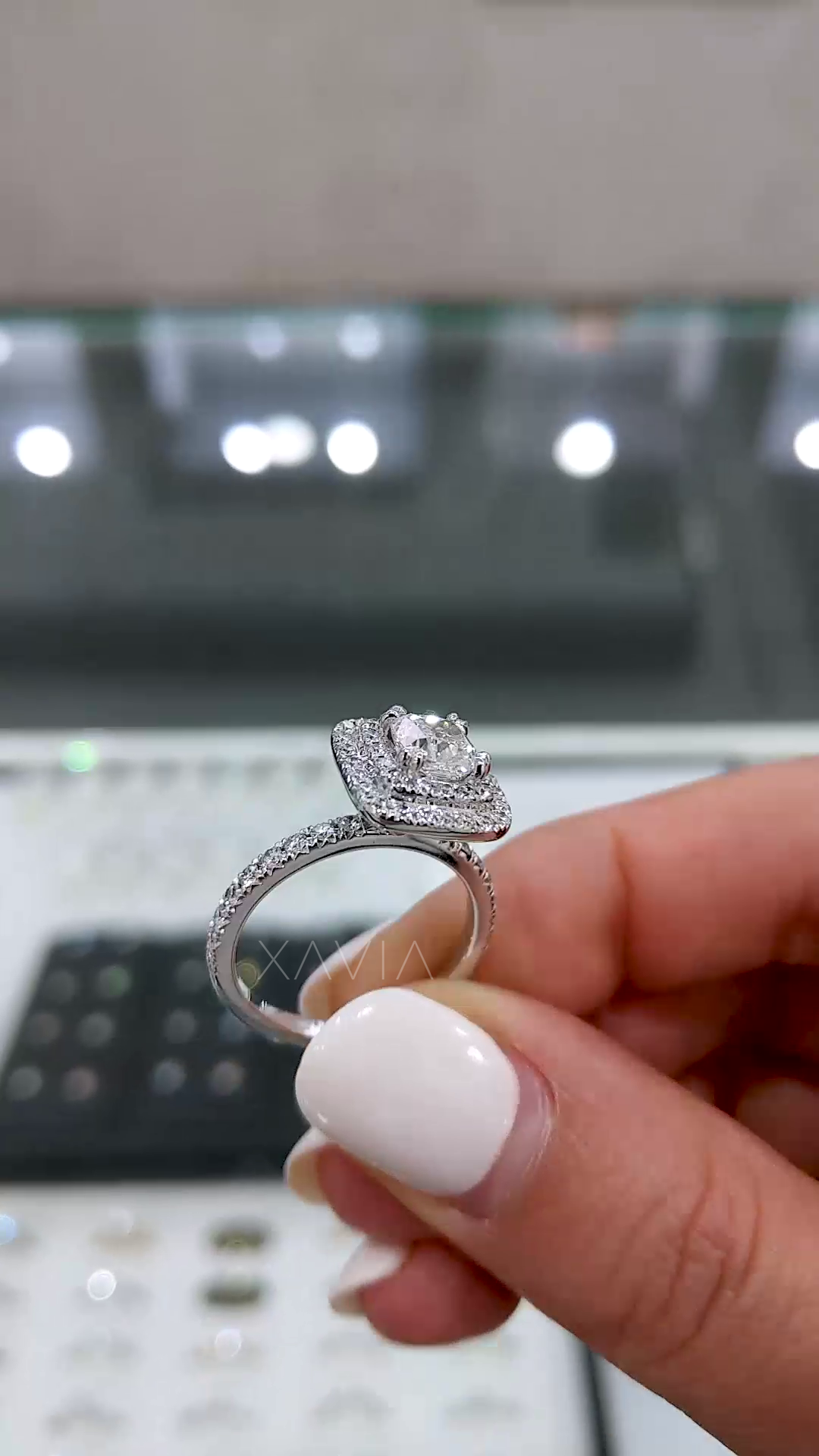 split shank diamond engagement ring with cushion center and double halo showing band detailing and fine micro pavé setting