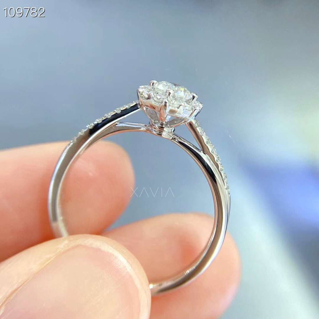 close-up detail of pavé diamond band and marquise floral halo on round lab grown diamond engagement ring