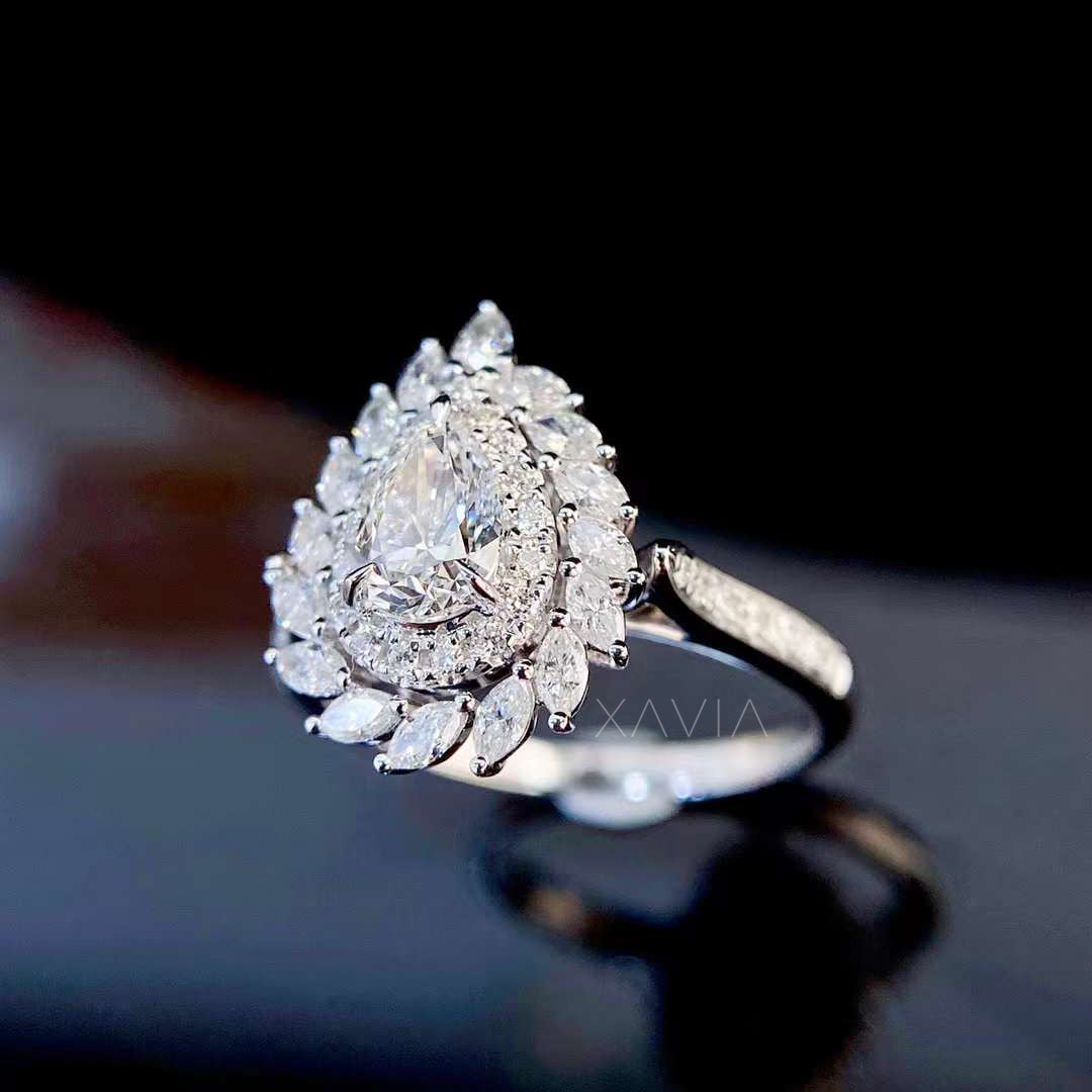 side profile of pear cut lab grown diamond engagement ring showing elevated halo structure and pavé diamond band