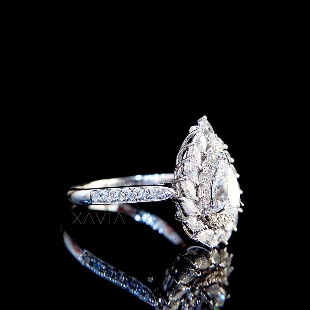 angled view of pear shaped lab grown diamond ring displaying layered halo depth and refined craftsmanship