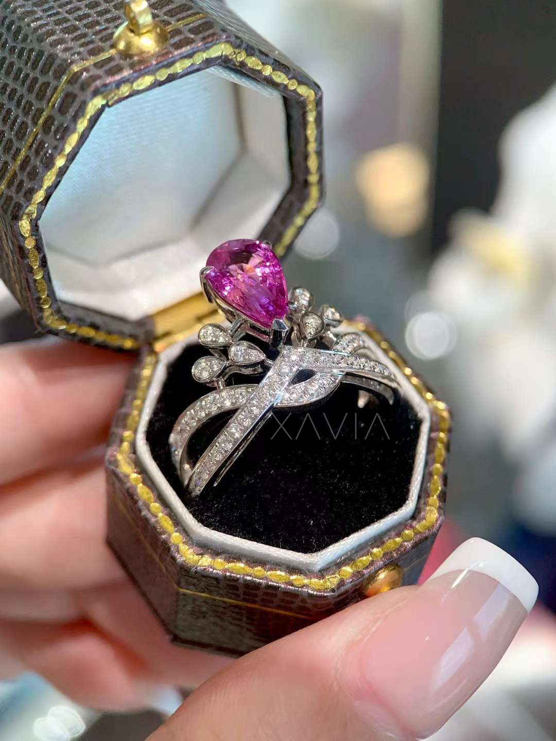 top view of pear shaped lab grown pink diamond ring with floral marquise halo and intricate pavé detailing