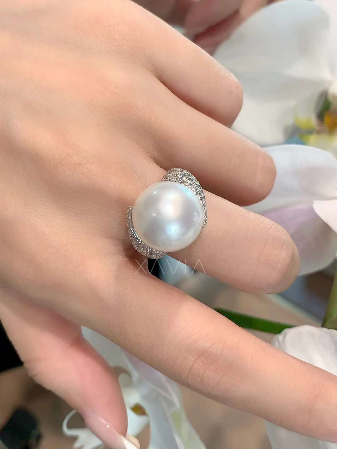 pearl diamond bypass ring worn on hand showing elegant scale, luminous pearl center, and pavé diamond sparkle for luxury styling reference