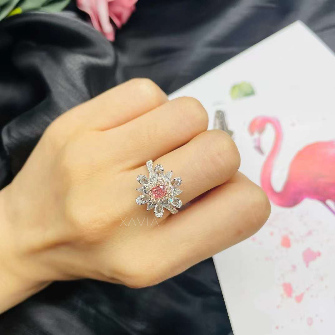 Front view of pink cushion cut lab grown diamond ring with marquise floral halo cluster set in white metal