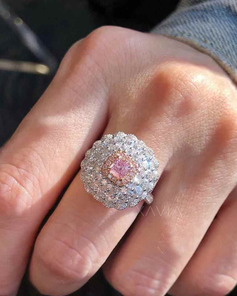 pink princess cut lab grown diamond floral halo cocktail ring worn on hand showing large diamond cluster halo sparkle and elegant setting