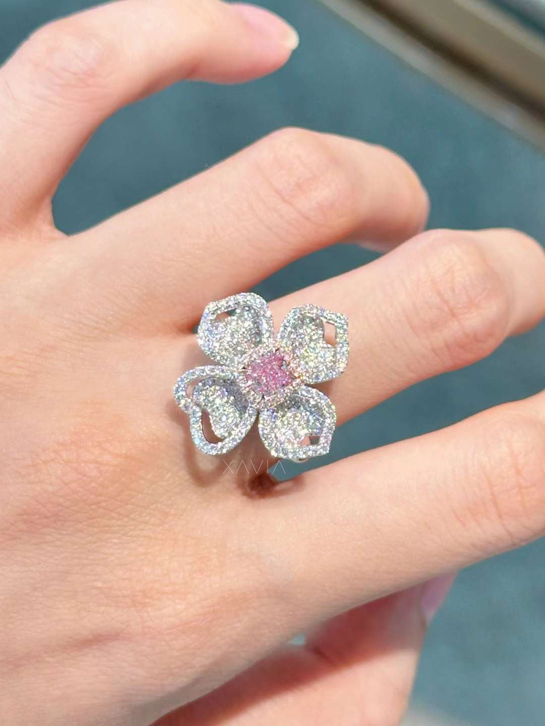 Petralisse cocktail ring with pink diamond and pavé petals worn on model’s hand under natural light