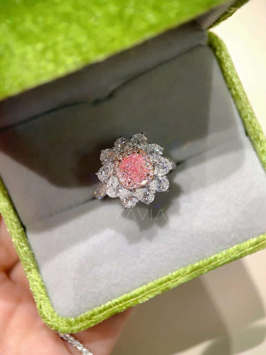 pink diamond flower ring presented in luxury velvet ring box