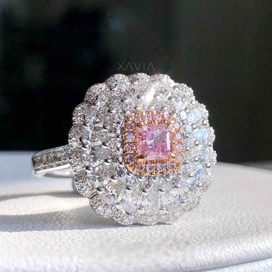 close up of luxury pink princess cut lab grown diamond ring surrounded by pavé halo and layered round brilliant diamond cluster halo