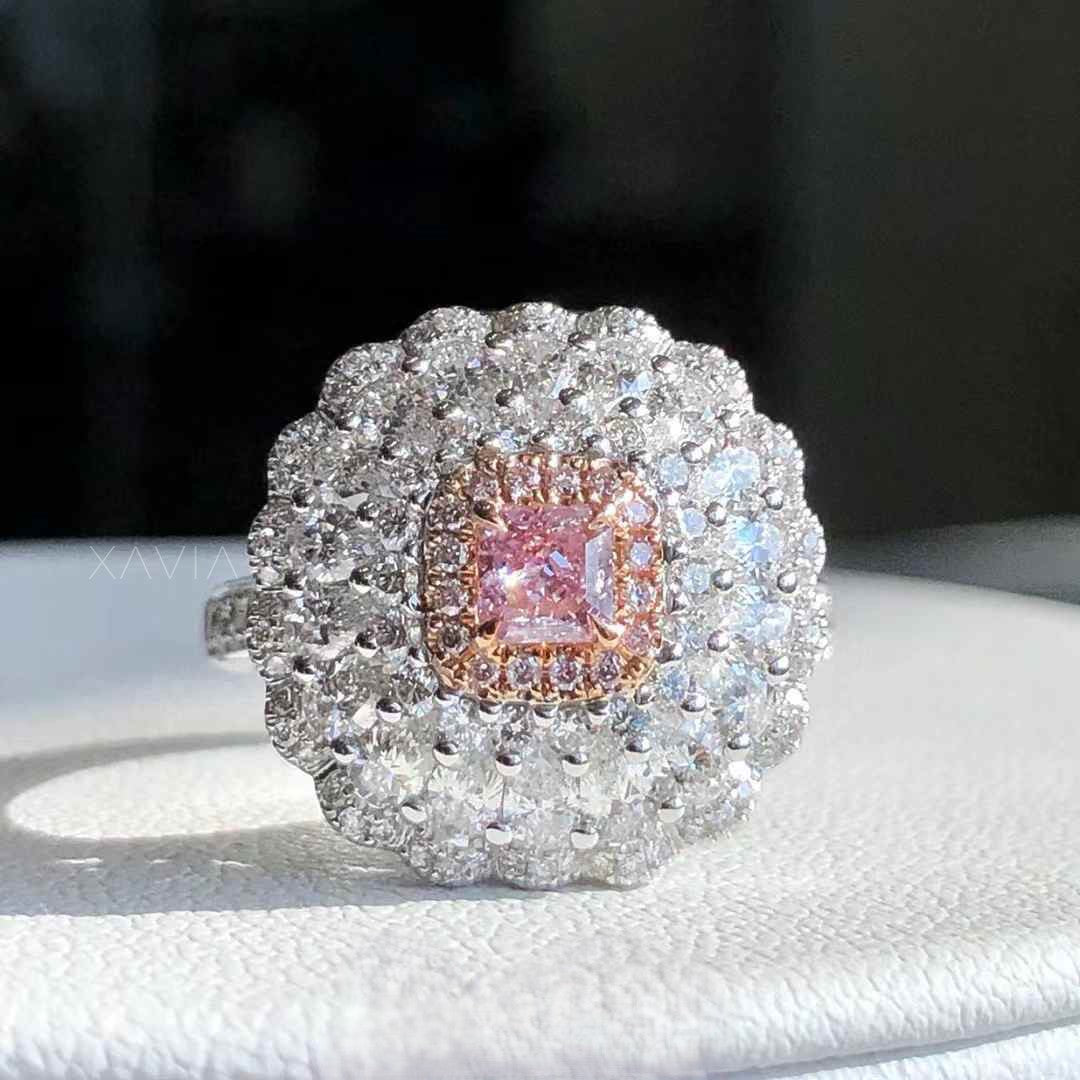 front view of pink princess cut lab grown diamond cocktail ring with rose gold halo and multi layer round diamond floral cluster halo setting