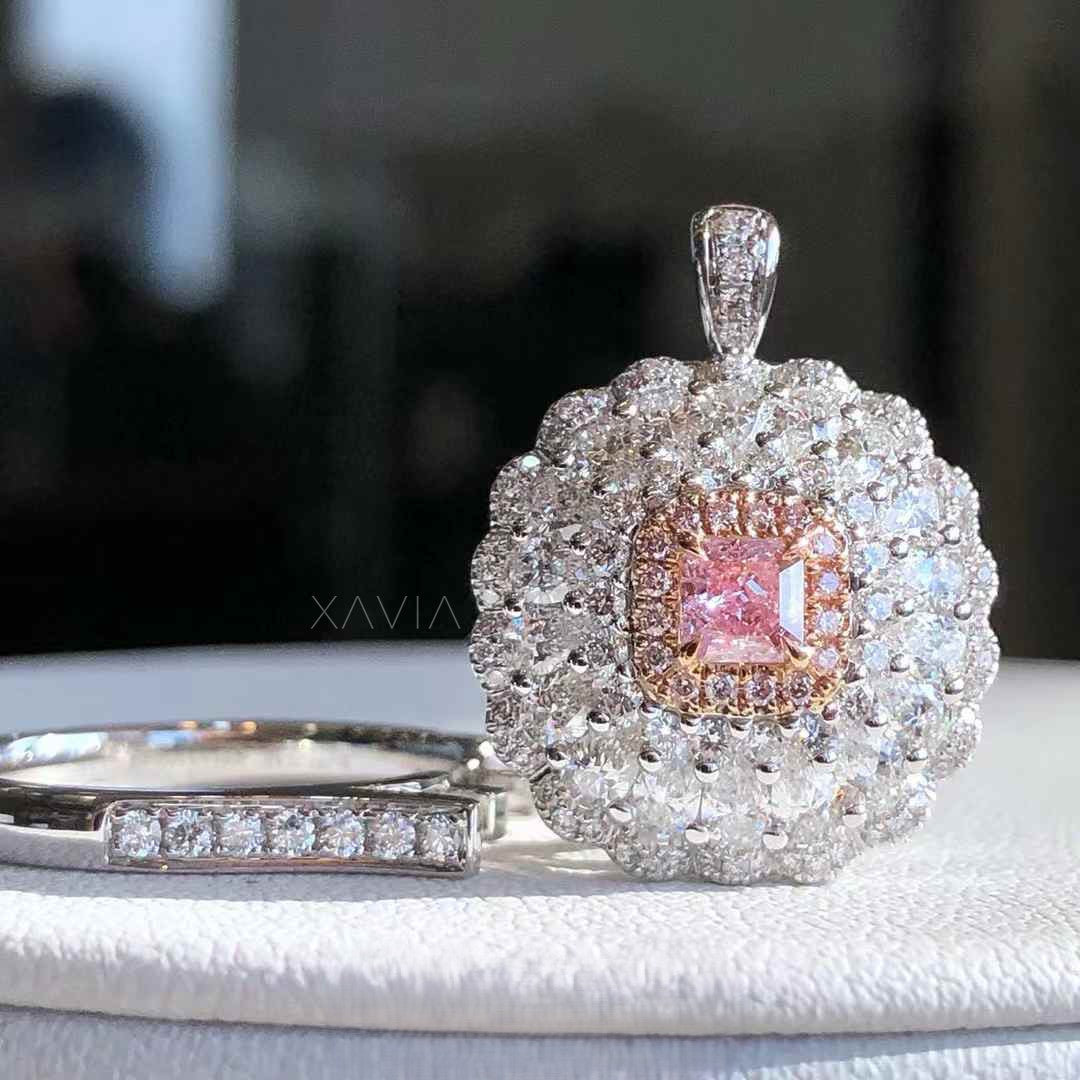 luxury pink princess cut lab diamond cluster halo ring displayed beside pavé diamond band showing layered floral halo design