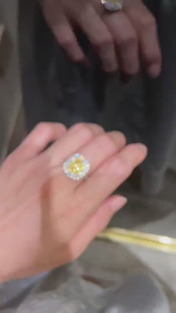 A 1.52 carat Fancy Yellow cushion cut lab diamond ring with VS clarity, double halo brilliance, crafted in solid gold or platinum.