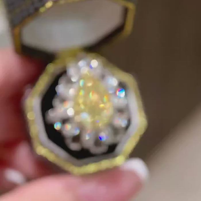 Solaretta – Fancy Yellow Pear Cut Diamond Halo Ring with Marquise and Round Brilliant Cluster Setting