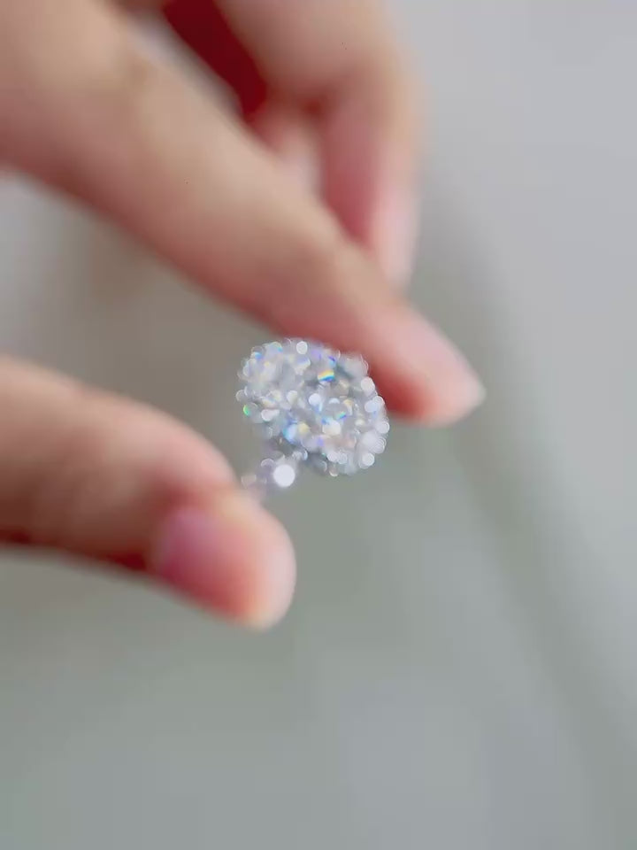 Oval cut DEF color lab-grown diamond center with pavé halo and pavé diamond band, crafted in solid gold or platinum with VVS–VS clarity brilliance.