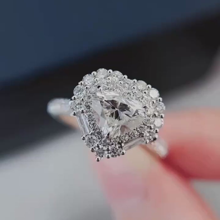 GIA-style heart cut lab-grown diamond center surrounded by brilliant round halo and tapered baguette accents, available in premium solid gold or platinum.