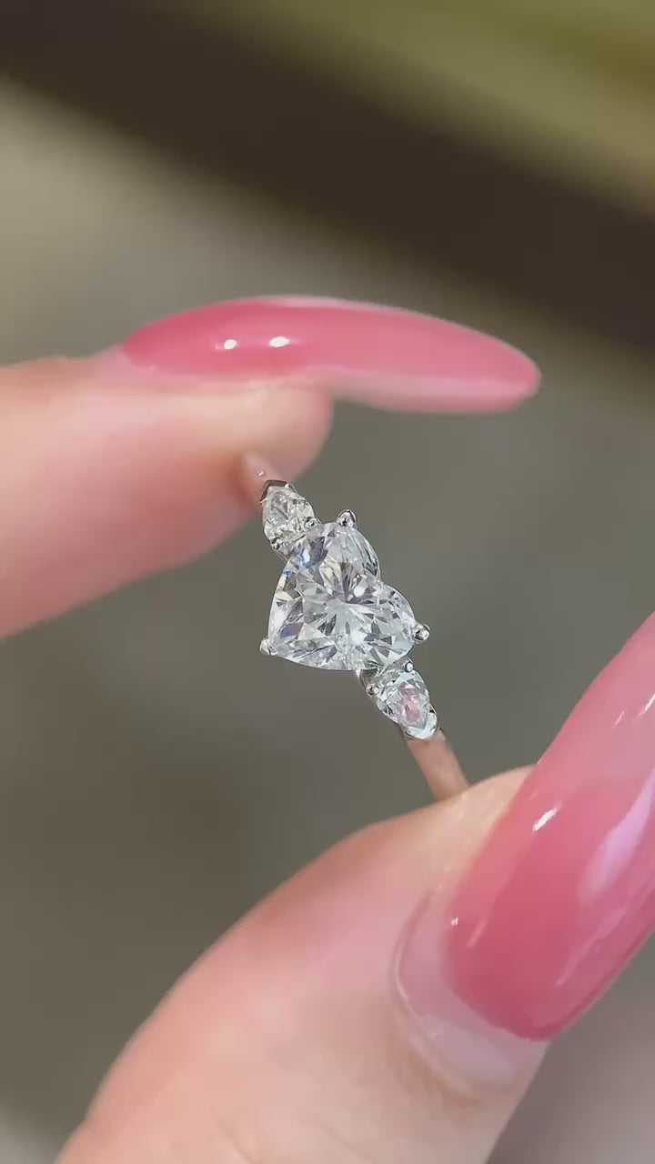 Heart-cut DEF color lab-grown diamond center with pear-shape side diamonds, VVS–VS clarity, available in 14K or 18K gold and platinum engagement ring.
