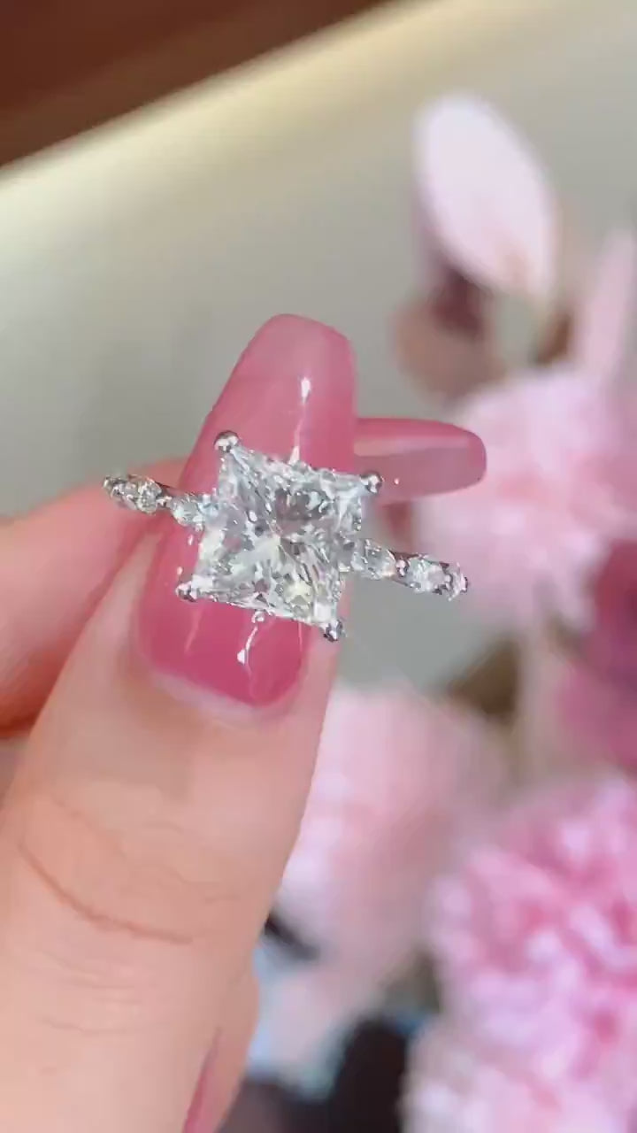 Princess cut lab-grown diamond engagement ring with DEF color VVS/VS clarity center stone, marquise accent band, available in platinum or solid gold.