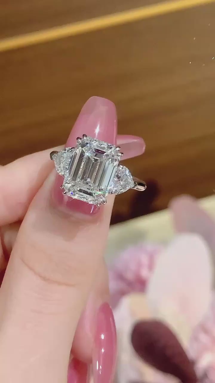 Emerald cut lab-grown diamond engagement ring featuring DEF color VVS/VS clarity center stone with trillion side diamonds in handcrafted white gold or platinum setting.