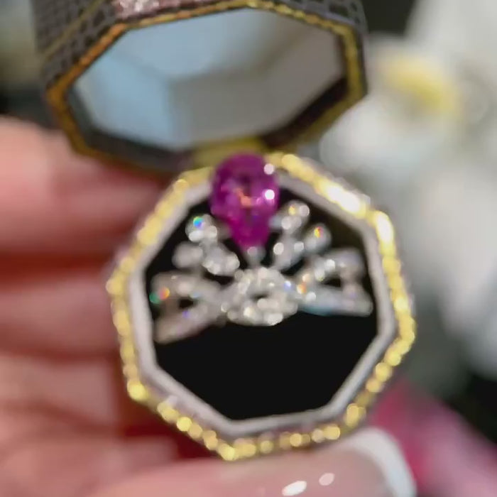 Discover a pear cut pink diamond engagement ring with floral marquise halo and twisted pavé band. Ethically crafted luxury by Xavia Jewels.