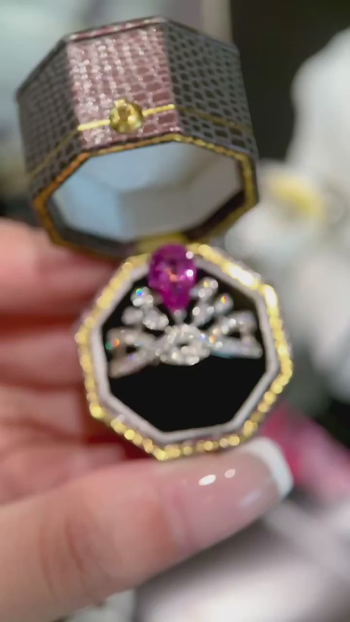 Discover a pear cut pink diamond engagement ring with floral marquise halo and twisted pavé band. Ethically crafted luxury by Xavia Jewels.