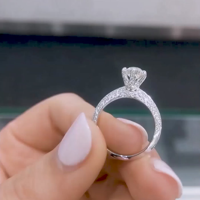 Round brilliant cut solitaire lab diamond ring with pavé split shank, photographed on model’s hand under natural lighting