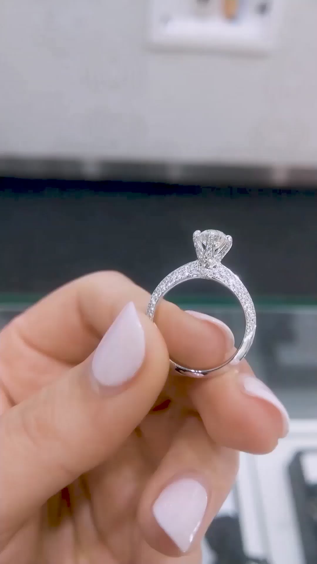 Round brilliant cut solitaire lab diamond ring with pavé split shank, photographed on model’s hand under natural lighting