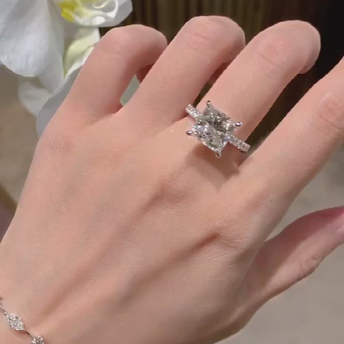 Luxury princess cut lab-grown diamond engagement ring featuring DEF color VVS/VS clarity center stone with pavé diamond band in solid gold or platinum.