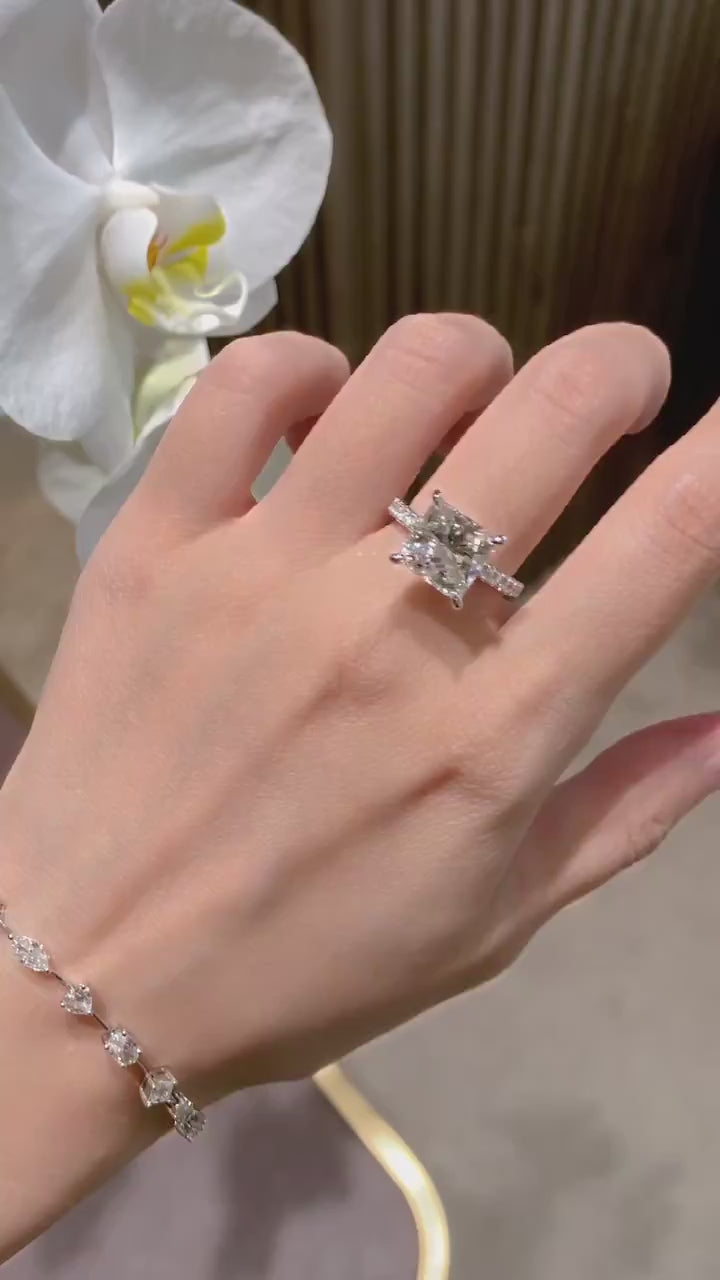 Luxury princess cut lab-grown diamond engagement ring featuring DEF color VVS/VS clarity center stone with pavé diamond band in solid gold or platinum.