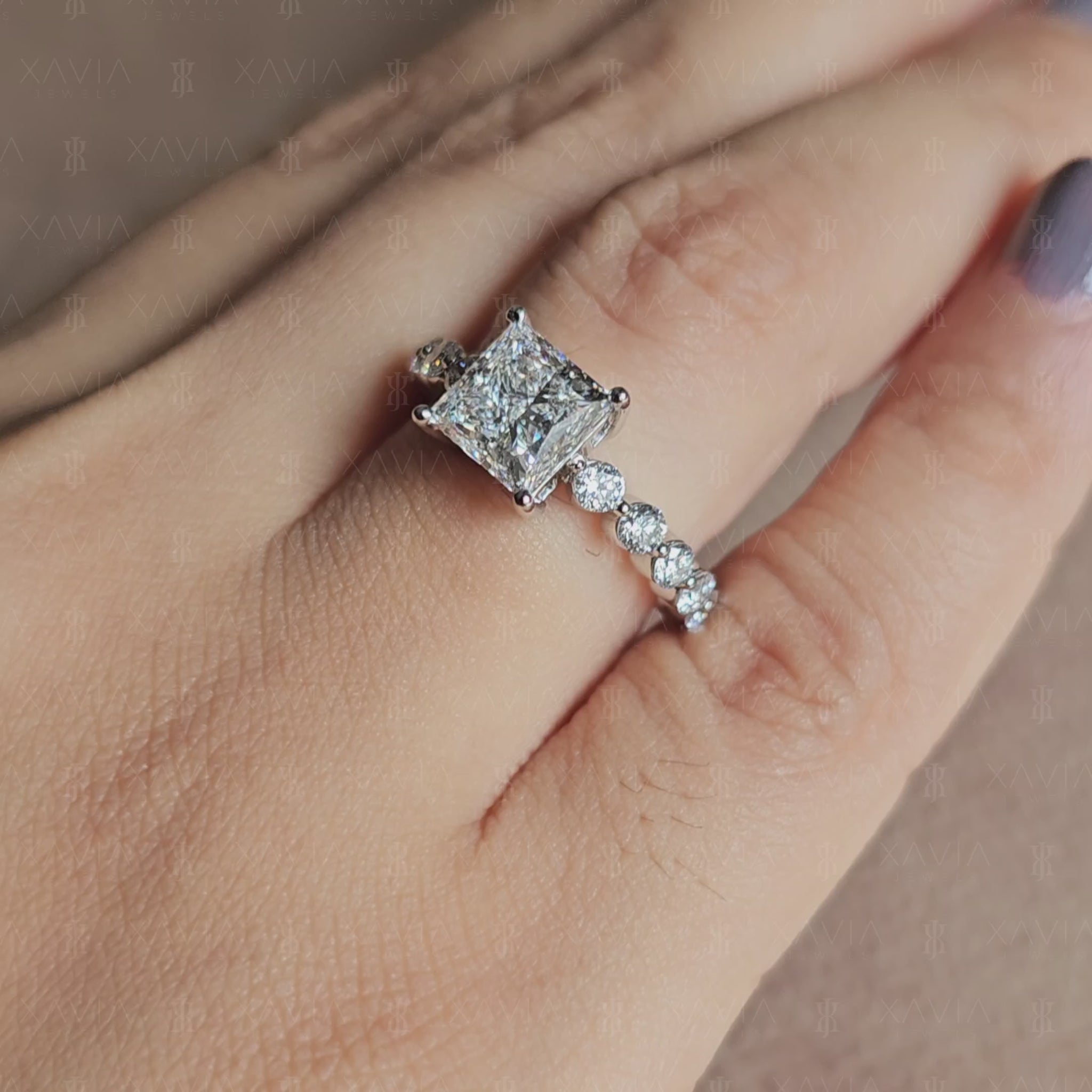 Front-facing view of princess cut lab diamond engagement ring with symmetrical four-prong setting and sparkling eternity-style