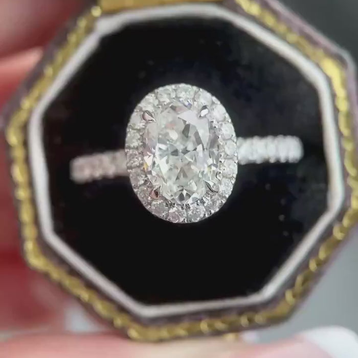 Oval lab-grown diamond halo engagement ring featuring DEF color VVS–VS clarity diamonds, triple pavé diamond vine band design in solid gold or platinum.